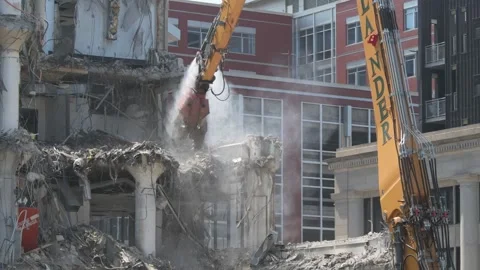 Construction crane demolishing a building to make room for a park Video stock 250360309