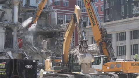 Construction crane demolishing a building to make room for a park. Video stock 250360616