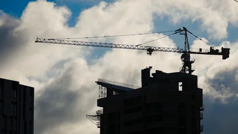 Construction crane at dusk. The building of the high-rise building. Timelapse Stock Footage 124312904