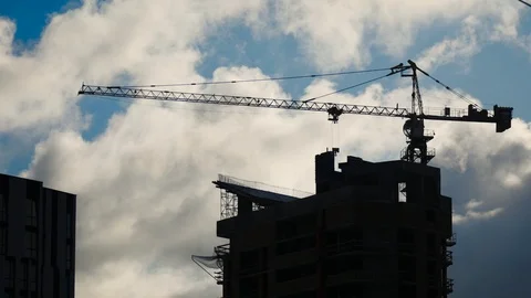 Construction crane at dusk. The building of the high-rise building Video stock 124312906