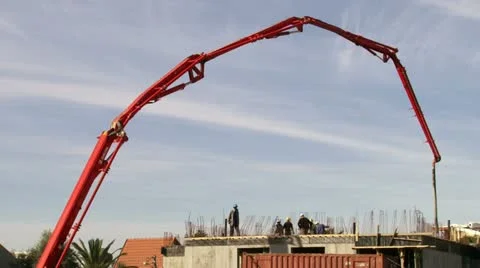 Construction crane filling cement on structure Stock Footage 20510948