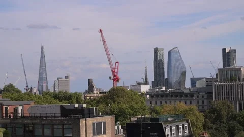 Construction Crane Framing The Shard and London Skyscrapers on Sunny Day 스톡 동영상 345010671