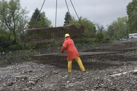 Construction crane with heavy load Stock Photos