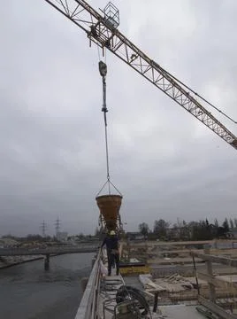 Construction crane with heavy load Stock Photos