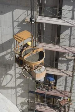 Construction crane with heavy load Stock Photos