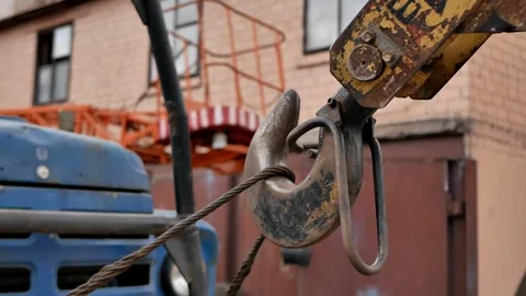 Construction crane hook on the background of the street that is being repaired Stock Footage 270519147