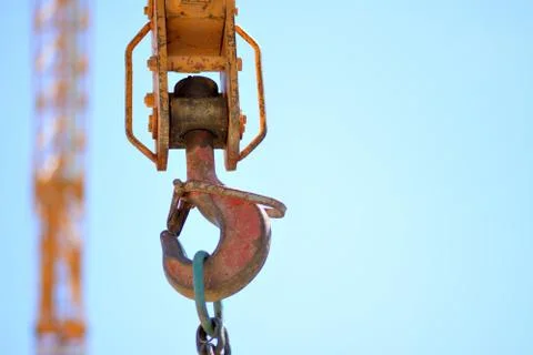 Construction crane hook in the blue sky. Stock Photos