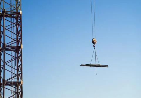 Construction crane hook with cargo in air Stock Photos