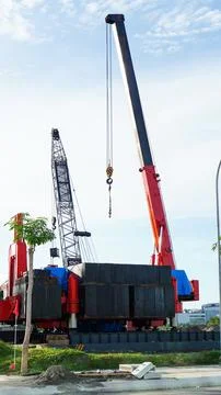 Construction crane hook in project area Stock Photos