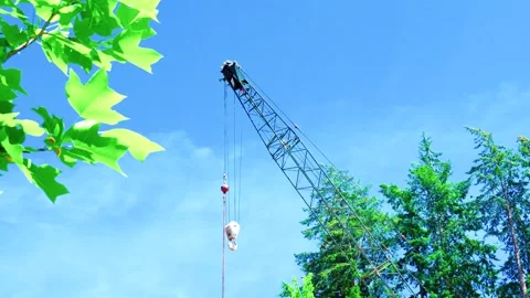 Construction crane lattice boom and lifting hook with copy space Video stock 335970292