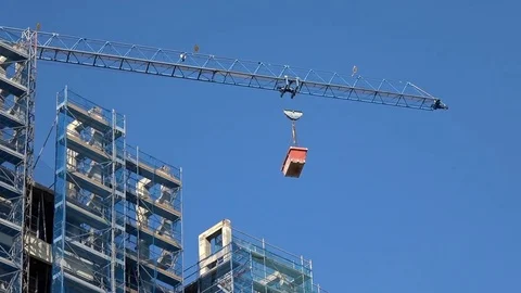 Construction crane lifting a container Stock Footage 82861405