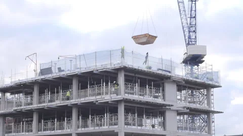 Construction Crane Lifting Skip Off A Construction Roof Video stock 150757852