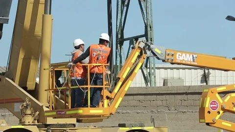Construction crane lifting workers Stock Footage 77048623