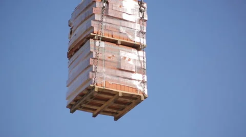 Construction crane lifts the bricks Stock-Footage 63170399