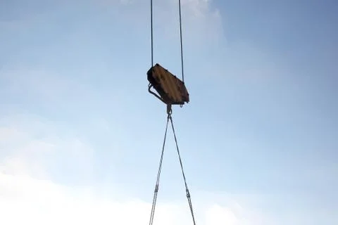 Construction crane lifts the load Stock Photos