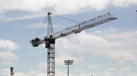 Construction crane maneuvering against the sky 스톡 동영상 58299219