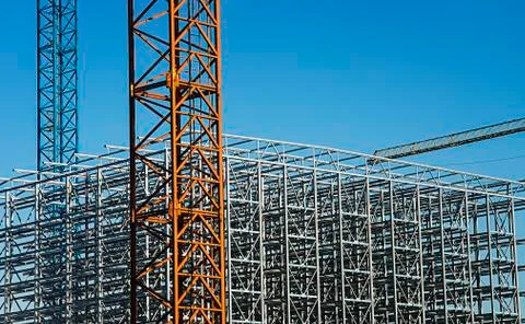 Construction crane with a metal structure frame. Stock Photos