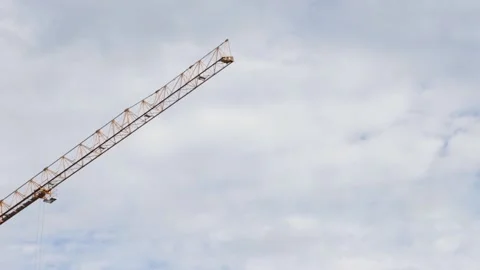 Construction crane moves against the background of the sky Stock Footage 222526997