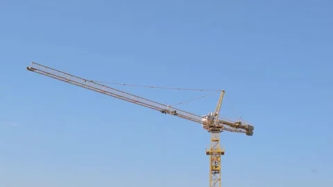 Construction Crane Moving Materials, Heavy Machinery at Work, Building Stock Footage 300897306