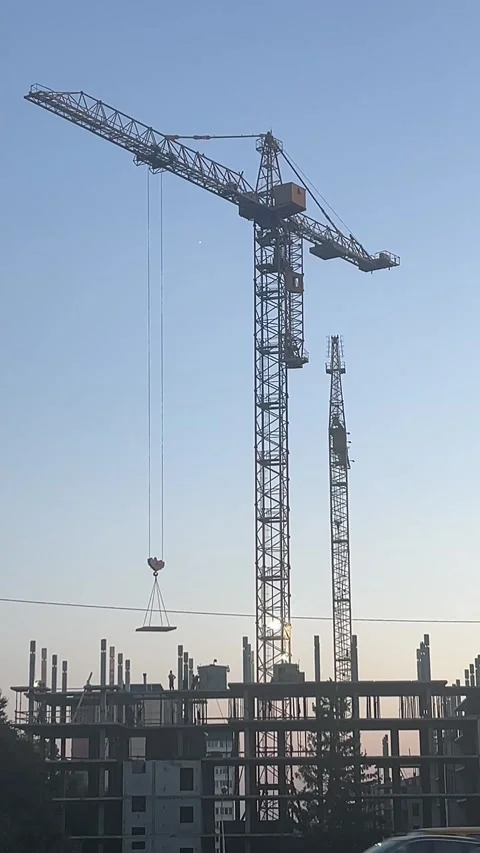 Construction crane operation: lifting a concrete slab. Stock Footage 346721777