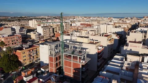 Construction Crane Over Building Site in City Aerial View 스톡 동영상 329707662