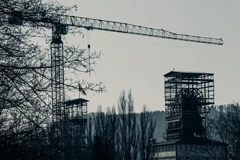 Construction crane over industrial site Stock Photos