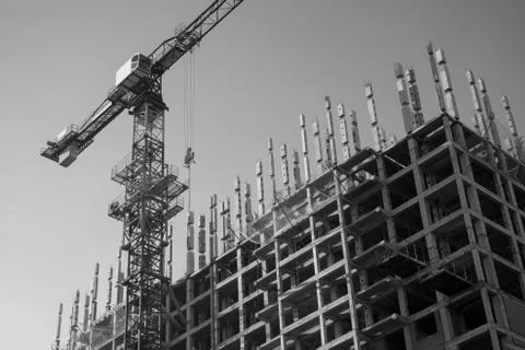 Construction crane in the process Stock Photos