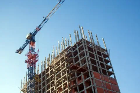 Construction crane in the process Stock Photos