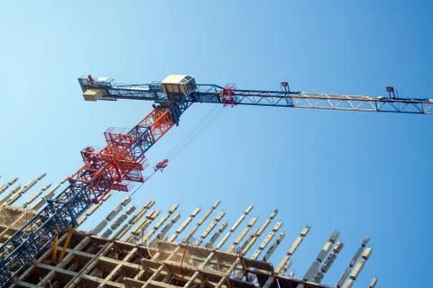 Construction crane in the process Stock Photos