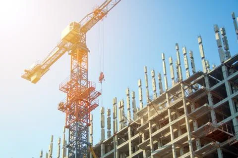 Construction crane in the process Stock Photos