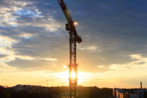 Construction crane with sunset Stock Photos