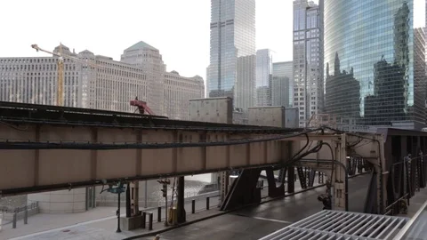 Construction crane swings as train passes Stock-Footage 91780626