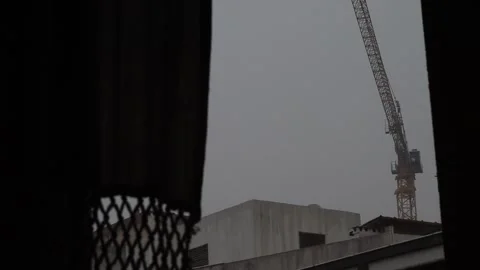 Construction Crane Through Window During Storm (Time-Lapse) Stock Footage 322124508