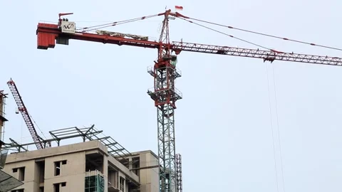 Construction Crane Towering Over Building Site Stock Footage 283626876