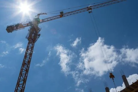 Construction crane towering over a building site Stock Photos