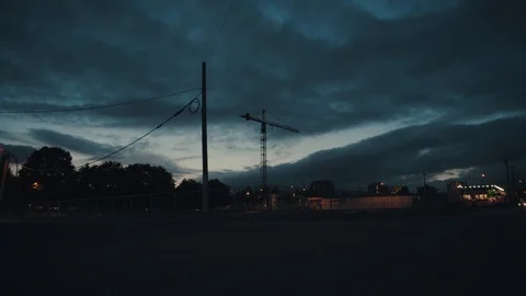 Construction crane under dark clouds at night 스톡 동영상 91609544