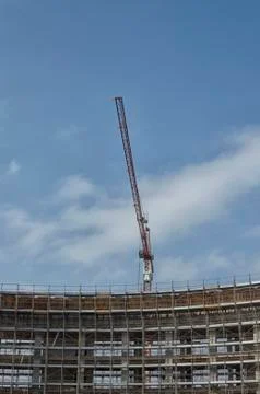 Construction crane at work Stock Photos