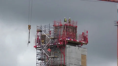 Construction crane workers movement zoom out Stock Footage 74120056