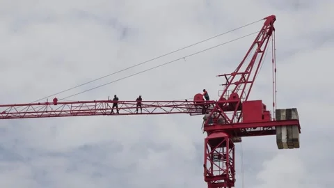 Construction Crane with Workers on Site. Stock Footage 314876473