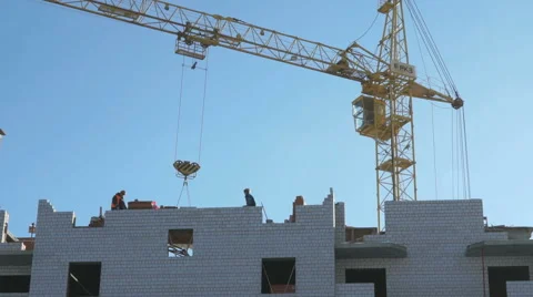 Construction crane, workers work in construction Stock Footage 60405269