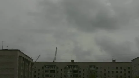 Construction crane working on the background of the house and sky Stock Footage 11964083