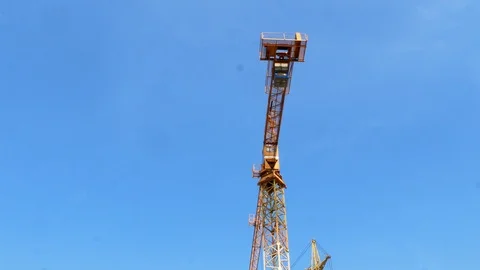 Construction crane working tower building 4k Stock Footage 107381760