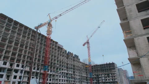 A construction crane works on a construction site. Stock Footage 252280765