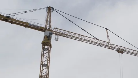 Construction Cranes against sky tilt down Stock Footage 81455012