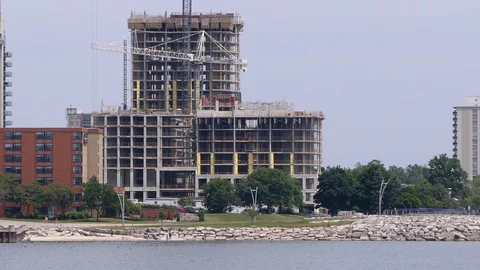 Construction cranes and building boom in the Toronto area for new condos Stock Footage 114446006