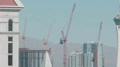 Construction cranes and desert mountains Stock Footage 98421390