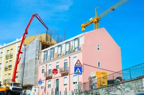 Construction cranes by appartment building Stock Photos