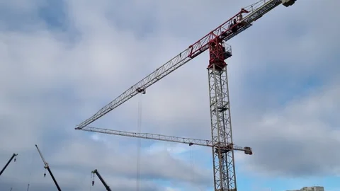Construction cranes are busy at work on a major building project Stock Footage 327158919