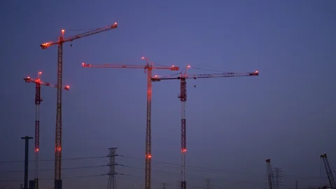 Construction cranes at the blue hour Stock Footage 129884061