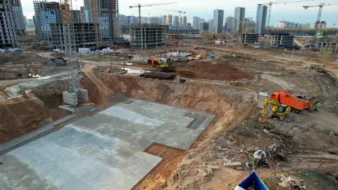 Construction cranes build new tall houses. Aerial video over a construction site Stock Footage 219507176